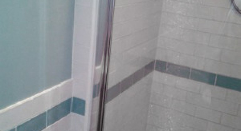 “Laura Ashley” tiles and a “Kudos” shower enclosure and shower tray complete the room.
